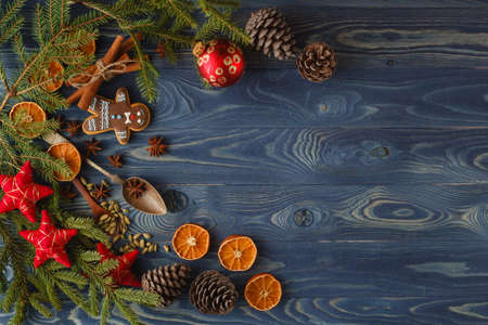 Christmas frame. Gingerbread cookies, spices and decorations on wooden background.の写真素材