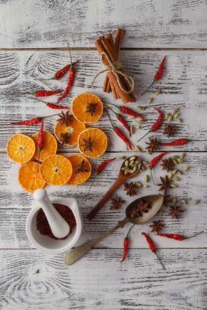 Christmas frame. Gingerbread cookies, spices and decorations on wooden backgroundの写真素材