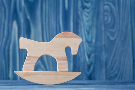 vintage rocking horse on wooden floorの写真素材