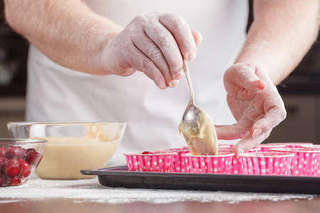 Preparing Cookies And Muffins at Homeの写真素材