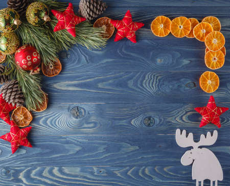 christmas tree with baubles and dry orangesÐ± deer in cornerの写真素材