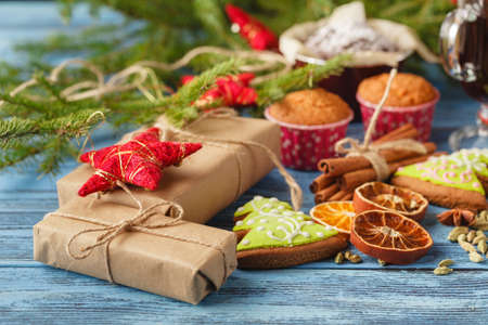 set of christmas or new year decoration with green fir tree with gingerbread, dry orange and anise on black backgroundの写真素材