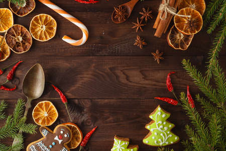 Collection of spices for mulled wine and pastry on the wooden tableの写真素材