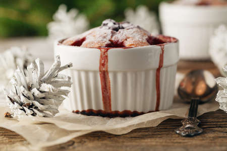 Cranberry muffins with powdered sugar and fresh berriesの写真素材
