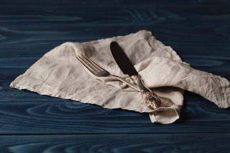 Vintage silverware on rustic wooden backgroundの写真素材