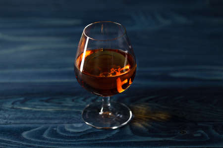 Brandy glass on the wooden tableの写真素材