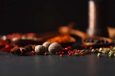 Group of mix spices with paprika on dark stoneの写真素材