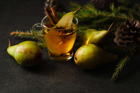 pear punch with sliced fruits and cinnamonの写真素材