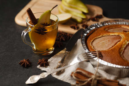 pear pie in holder on dark stone tableの写真素材