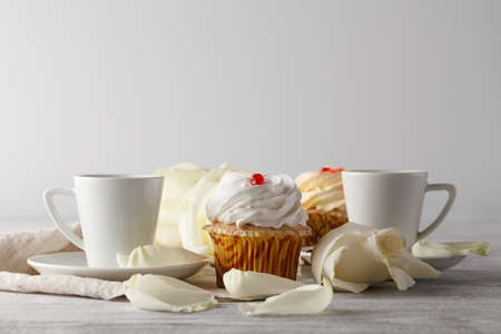 White roses and black coffee on whiteの写真素材