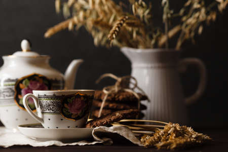 Seasonal tea at evening with oat cookiesの写真素材