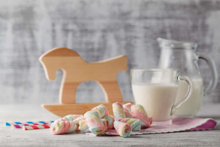 Baby breakfast with milk and cupcakesの写真素材