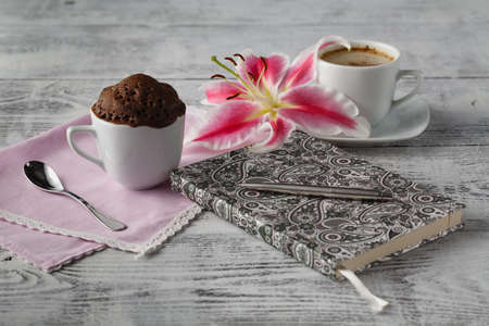 Thinking in coffee time with teacup cupcakeの写真素材