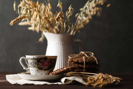 Seasonal tea at evening with oat cookiesの写真素材