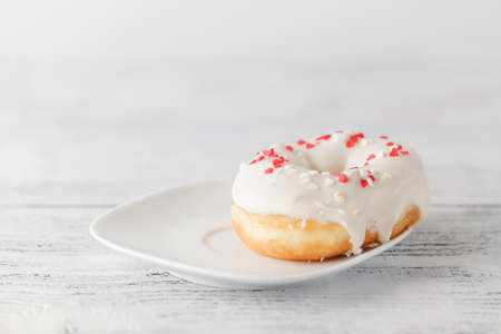 One iced donut on plateの写真素材