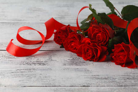 Bunch of red roses on tableの写真素材