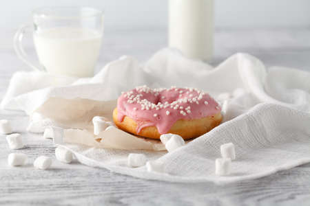 Pink donuts with milk glass and bottleの写真素材