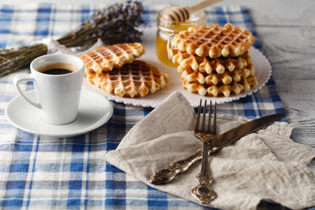 Homemade Viennese wafe with honey on tableの写真素材