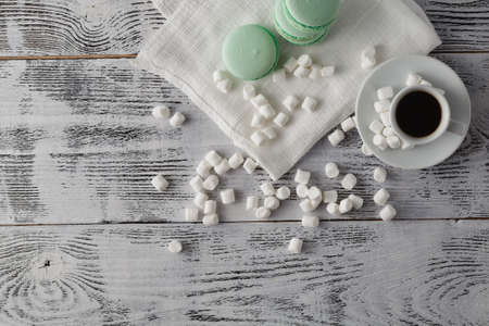 Breakfast on table. Coffee and milk with macaroonsの写真素材