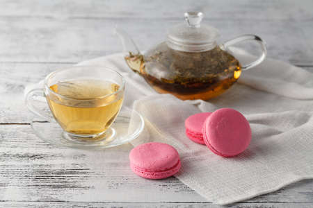 Breakfast with tea and three macaroonsの写真素材