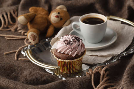 Relaxing coffee cup and books lay on plaidの写真素材