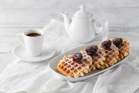 Brussels waffles with berries and coffee