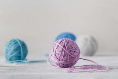 Needlework hobby concept. Wool clews on table