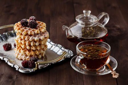 Tea in glass cup for breakfast on metal trayの写真素材
