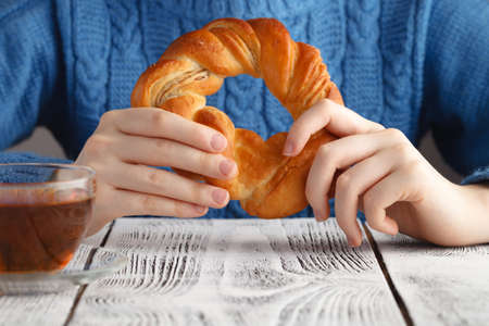 Fresh pastry for breakfast on wooden tableの写真素材