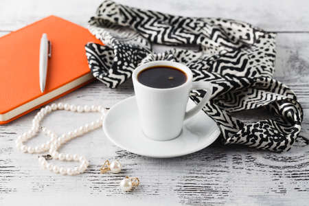 Morning brearfast on table with bijouterie and coffee cupの写真素材