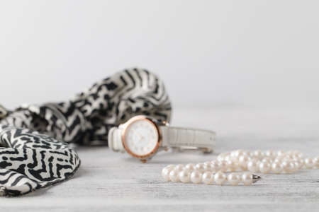 woman scarf on table with parfume and pearl bijouterieの写真素材