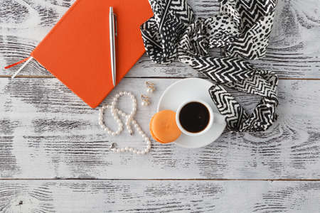 Morning breakfast on table with bijouterie and coffee cupの写真素材