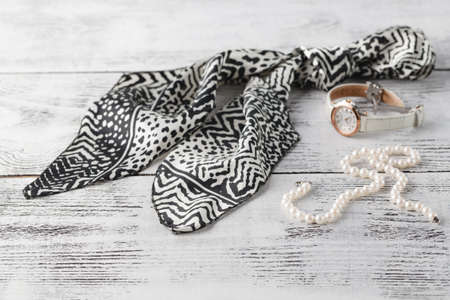 woman scarf on table with parfume and pearl bijouterieの写真素材