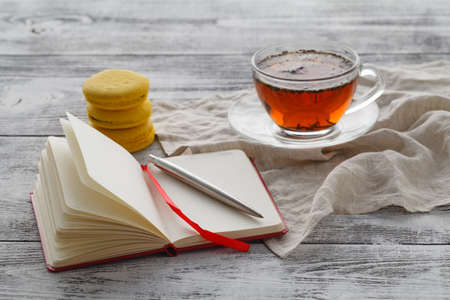 Ready to drink tea with macaroon on white tableの写真素材