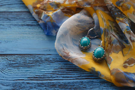 Image  of bijouterie closeup on blue tableの写真素材