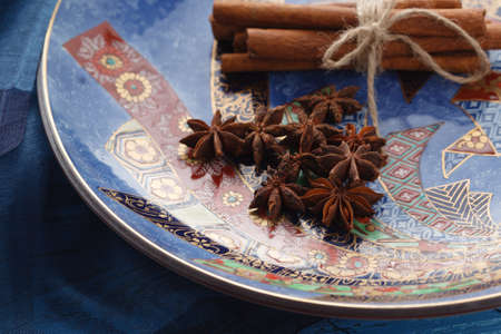 Closeup view of plate with orient spices on tableの写真素材