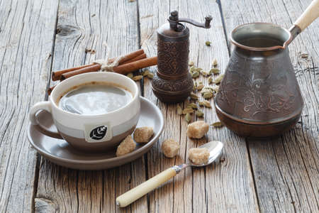 cup with coffee on wood table with sugarの写真素材