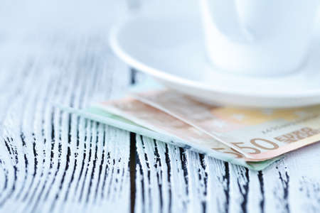 Coffee and money, closeup view