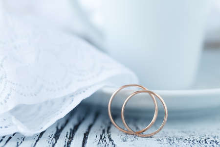 Coffee with wedding ringsの写真素材