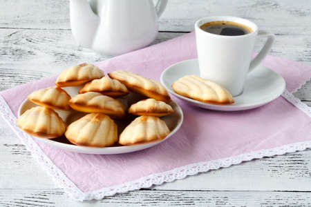 Madeleine on a pink plateの写真素材