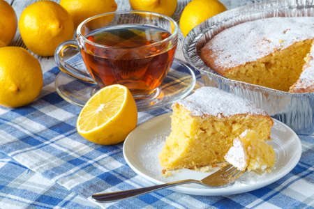 Lemon yogurt loaf cake, sliced on plateの写真素材