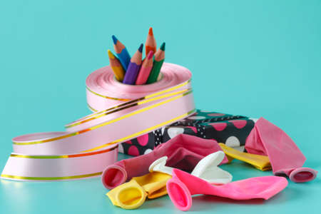 Materials and accessories for wrapping gifts on aquamarineの写真素材