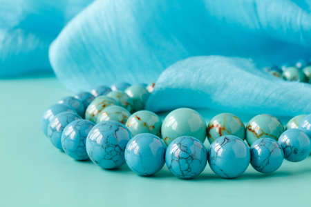 Necklace strand, blue backdropの写真素材