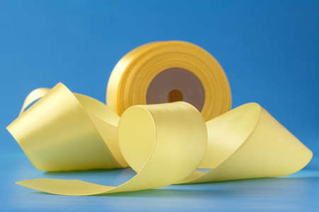 Yellow ribbon rollsの写真素材