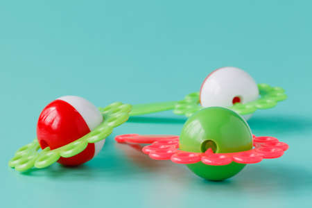 Baby rattle on blue background