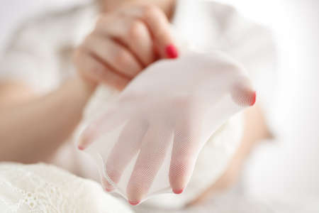 Woman checking her white stockingsの写真素材