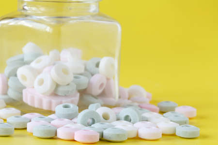 sweet drugs spilled out of the glass jar