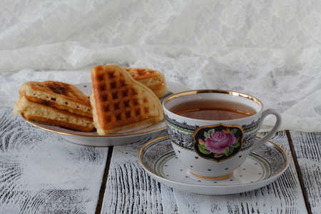 Breakfast with White Cup of Tea with Wafflesの写真素材