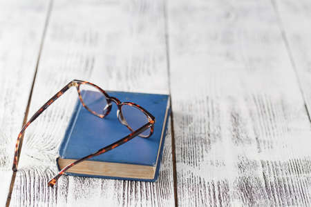 Lying book and glasses.の写真素材