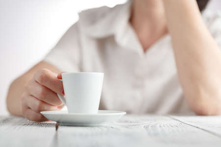 Female hands and cup of coffeeの写真素材
